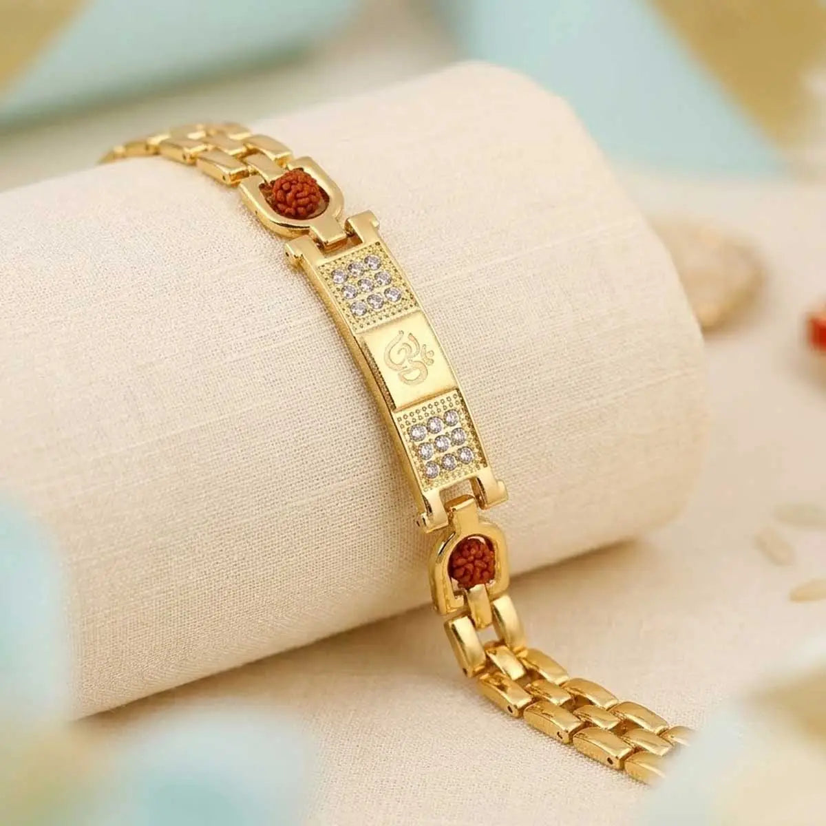 Spiritual Om bracelet with gold finish and Rudraksha accents